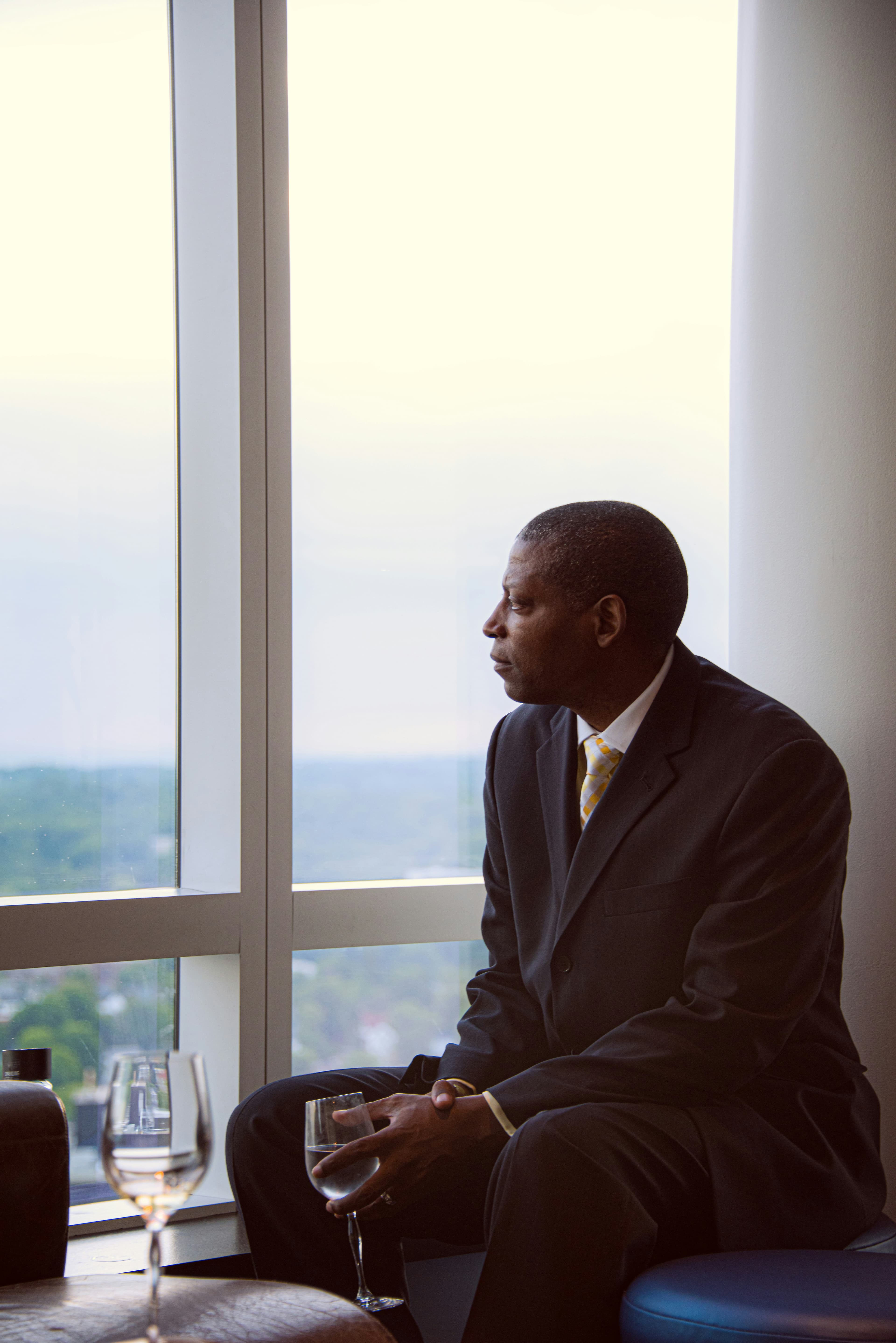 Executive man looking out window